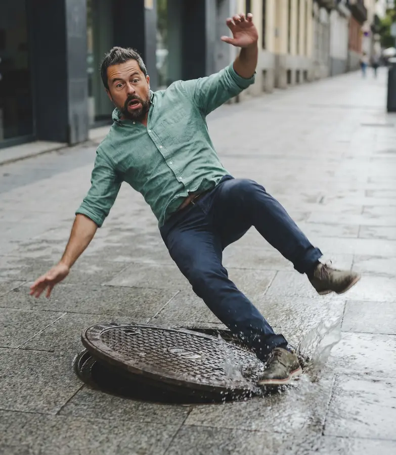Falling over a loose manhole cover